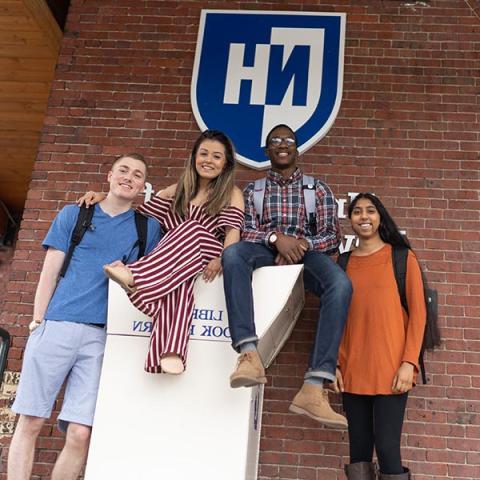 UNH Manchester students next to book return